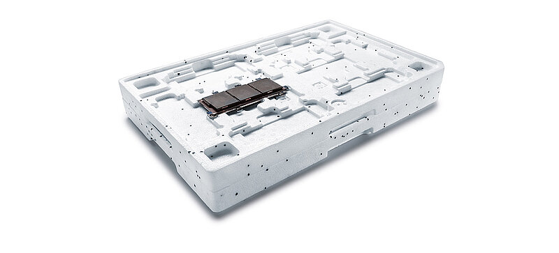 
		  Two cargo carriers stacked on top of each other, with a circuit board