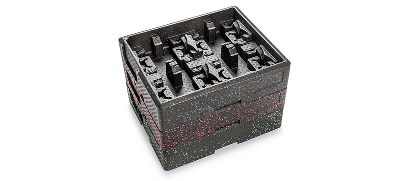 Three stacked black load carriers with three different color accents.